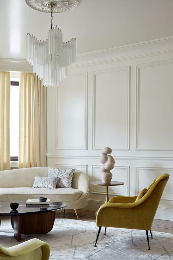 A living room by Lashmanova Design showing a lovely monochromatic yellow color scheme