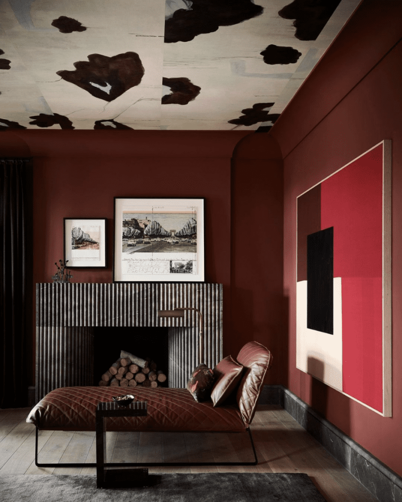 A living room featuring deep red hues like burgundy, oxblood, and cranberry