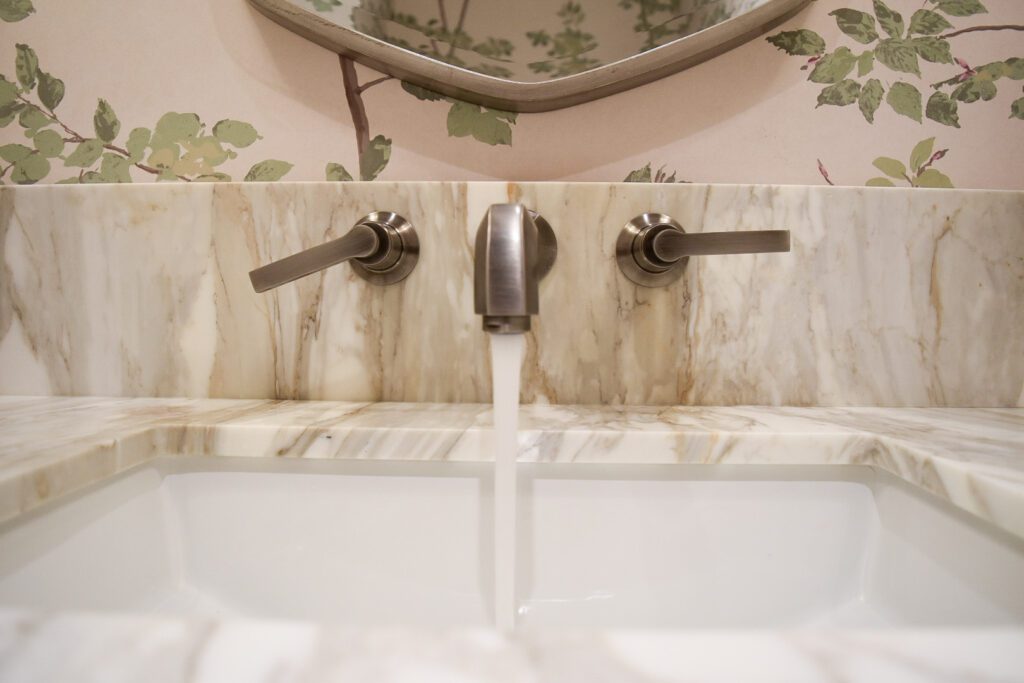 Detail image of stone countertop and bathroom plumbing at Ranger Crescent renovation