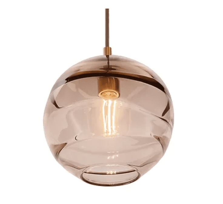 A pendant light fixture with warm, smokey brown glass.