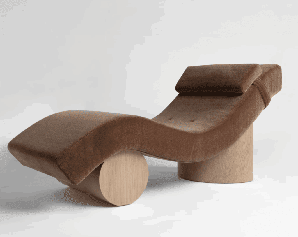 A curvy chaise longue upholstered in Pantone's colour of the year Mocha Mousse velvet.