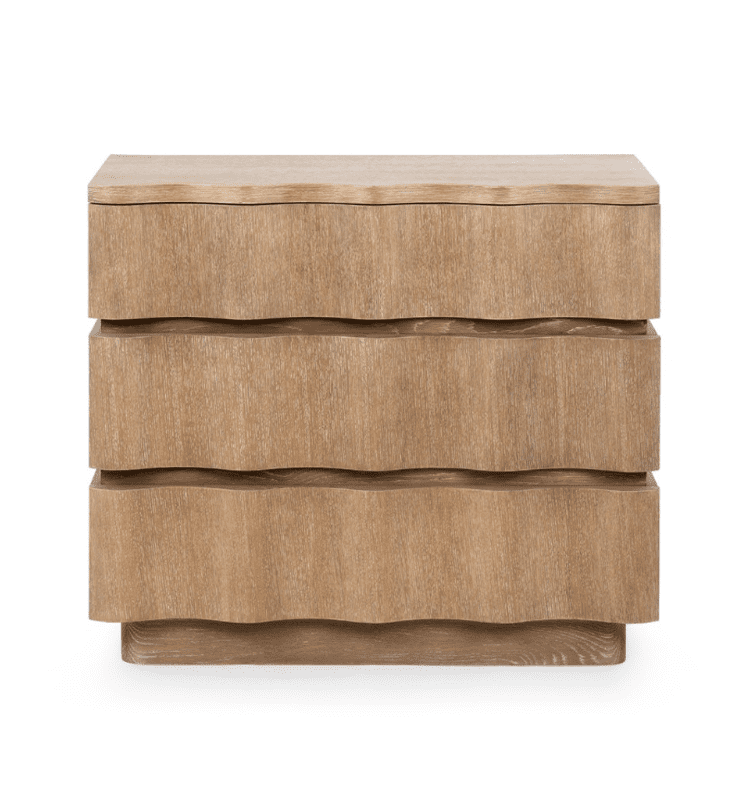 A bedside chest with wavy front panels.