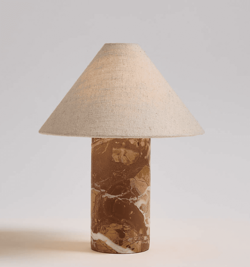 A small table lamp made from red marble.